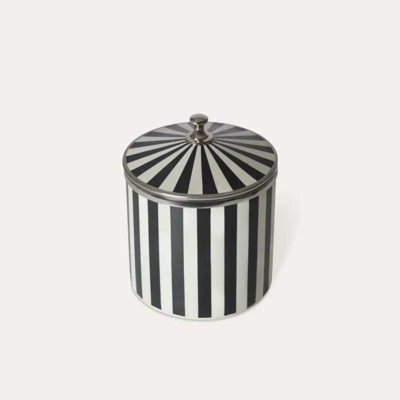 Black and white striped circular ice bucket with a lid, chrome silver details handle and edges on a light background.
