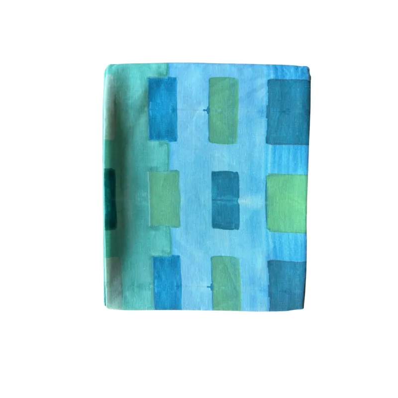 Blue Tapestry linen tablecloth styled on dining table with matching napkins - Goldie Home
