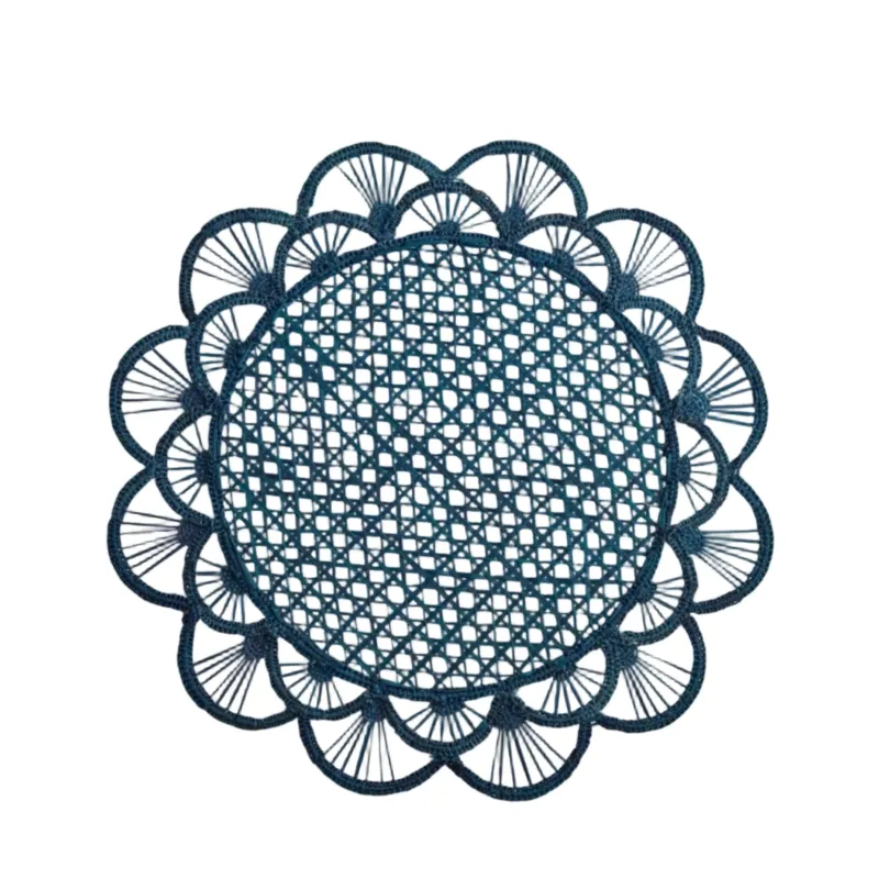 Margarita placemat in deep blue, handwoven iraca palm, styled on a table