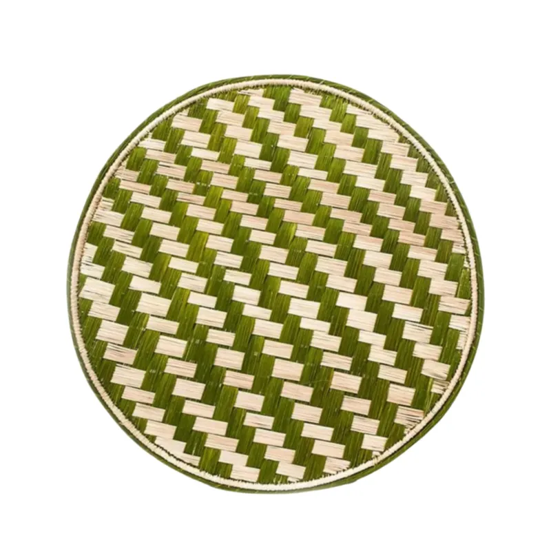 Escalera stepped-pattern placemat in green, handwoven iraca palm, on a table
