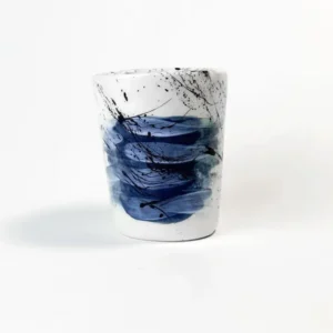 Ceramic mug with Greek flag abstract design on a white background