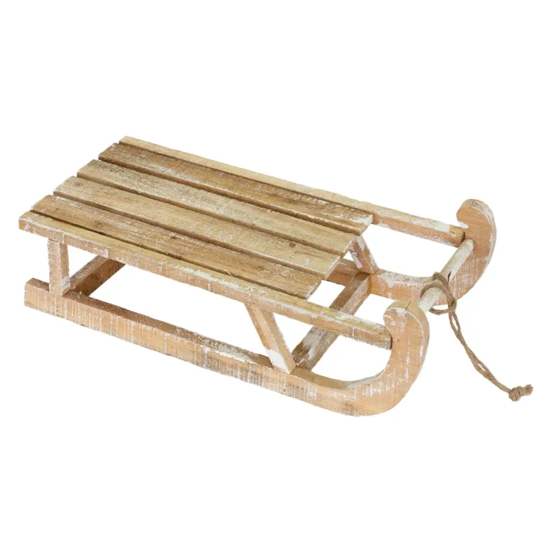Holzschlitten mit mehreren Latten und einer Schnur zum Ziehen.