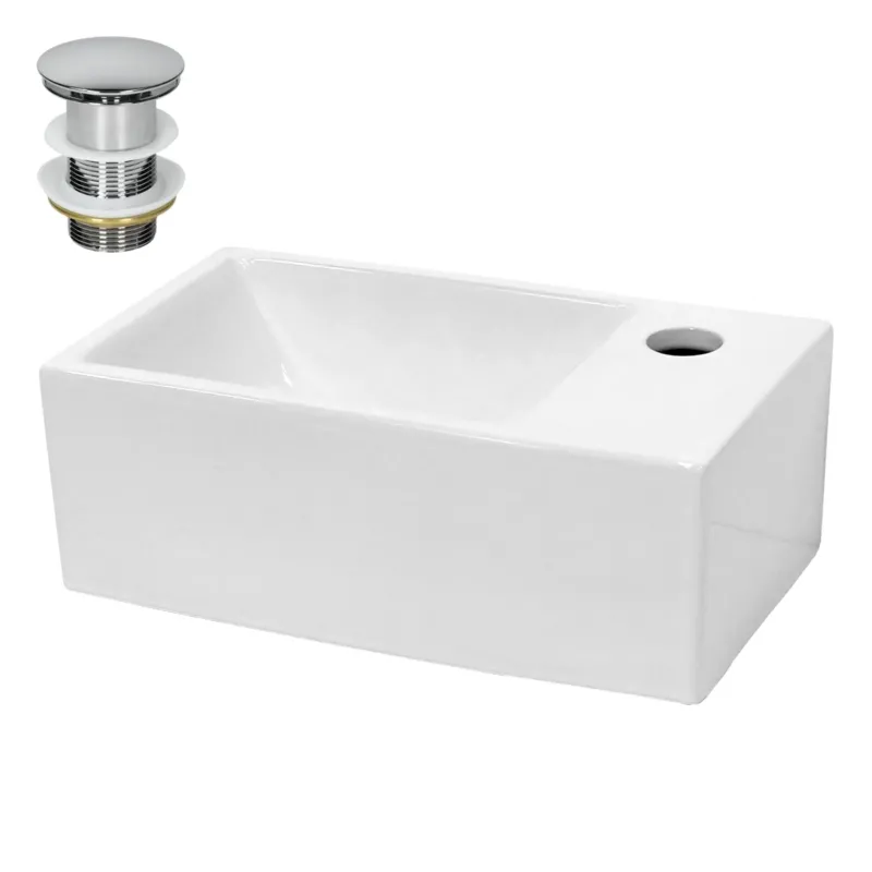 Weißes Waschbecken mit Abfluss und Überlauf.