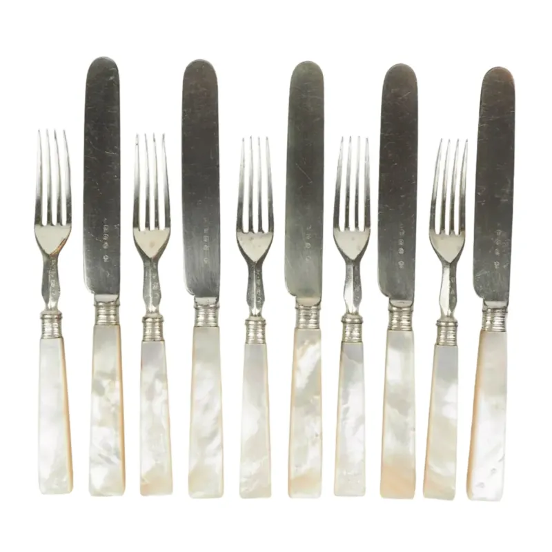 10 piece Antique Mother of Pearl Cutlery Set. The aged silver plate and mother of pearl handles give this set of knives and forks an antique look